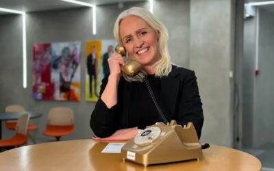 Woman speaking by phone.
