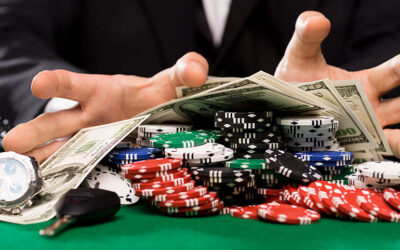 Dollars, playing cards, dice on a table