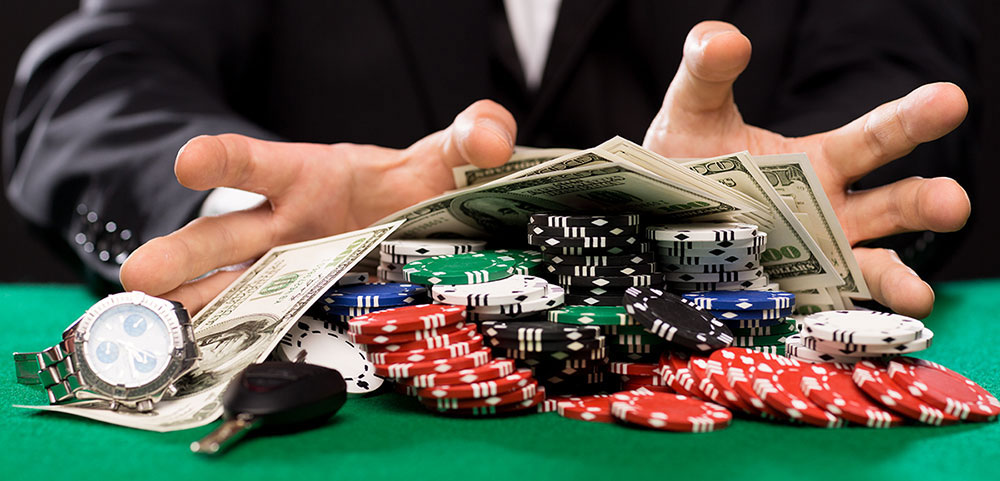 Dollars, playing cards, dice on a table
