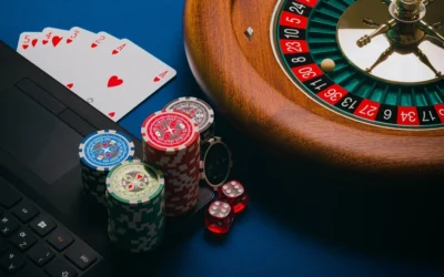 Playing cars, casino chips, roulette wheel.